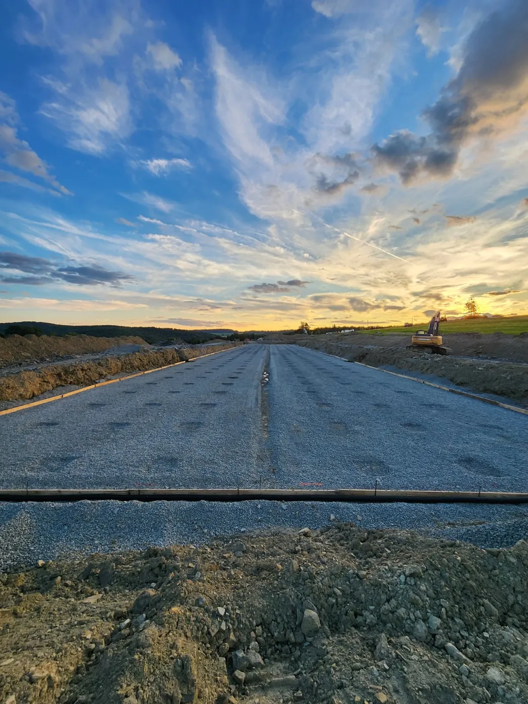 Finished aggregate building pad